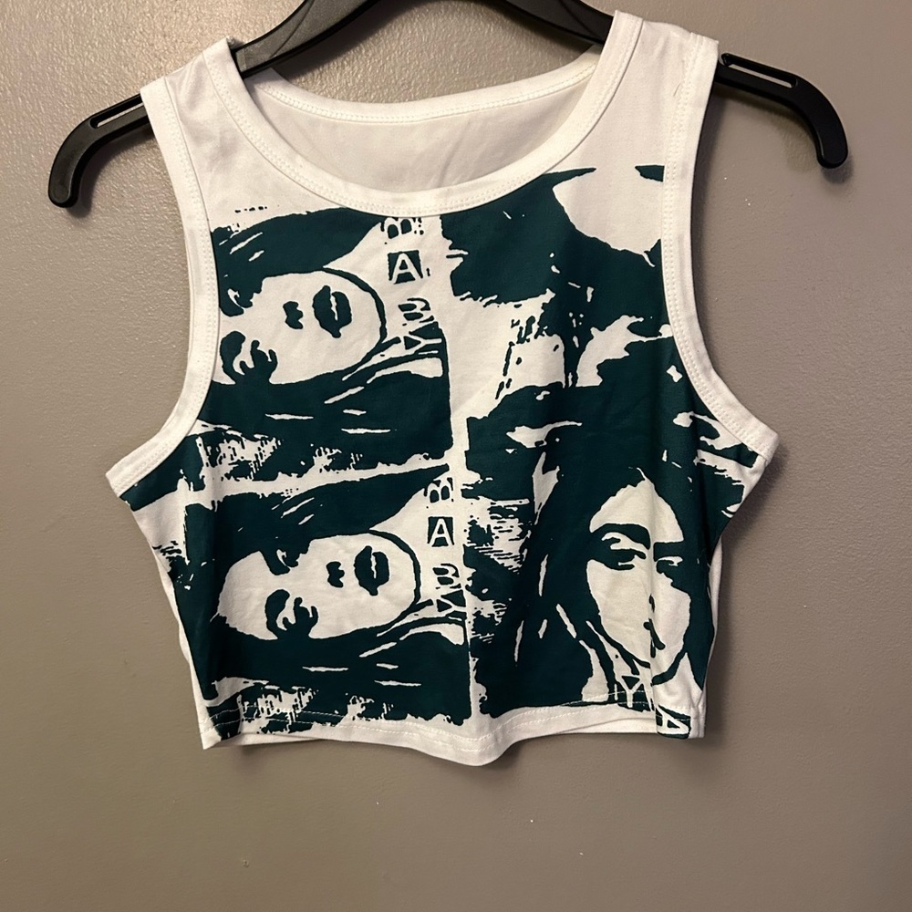 white with green graphic print sleeveless cropped top